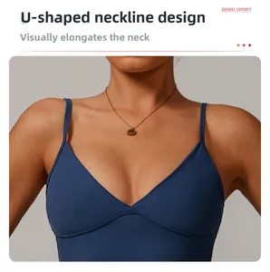 Detail of dark blue sports bra with U-shaped neckline and thin straps in matte fabric