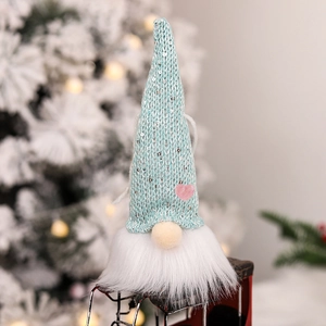 Lighted Christmas gnome ornament with sequins and white beard on a festive tree