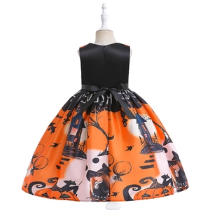 Back view of girls' Halloween pumpkin witch dress featuring a black bow and satin skirt