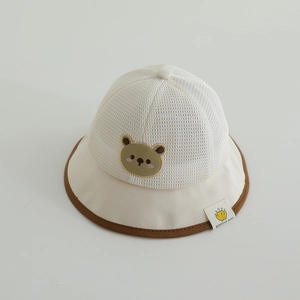 Detailed view of the breathable mesh crown and cute bear patch on baby sun hat