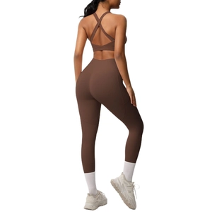 Chocolate brown two-piece yoga set with cross-back sports bra and high-waisted leggings
