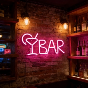 Pink LED neon sign BAR and cocktail icon on a vintage brick wall for party decor
