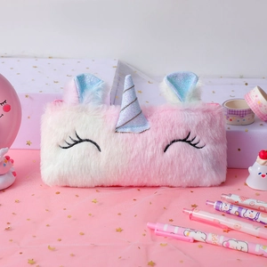 Close-up of plush unicorn pencil case showing soft faux fur and sequined horn detail