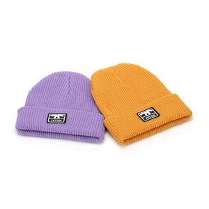 Winter knitted beanie hats in purple and yellow with ribbed texture and logo patch