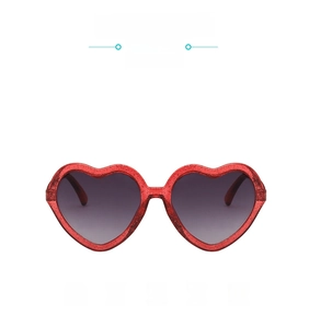 Detail of red glitter heart-shaped frame and dark grey lenses for kids sunglasses