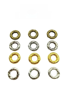 Detail view of four colors of Tibetan silver alloy cloud pattern sliding rings for DIY jewelry