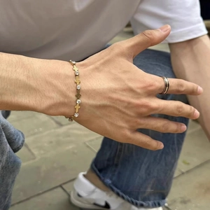 Adjustable golden titanium steel bracelet for men with cross link and white zircon inlay