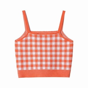 Detailed close-up showing the knit texture and orange checkered pattern of the camisole top