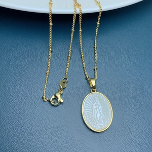 Oval gold Virgin Mary pendant necklace with white mother of pearl inlay on bead chain