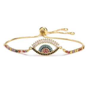 Bracelet œil porte-bonheur ajustable doré avec zircons multicolores et détails cils