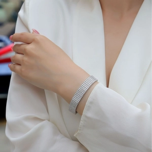 Elegant silver-toned wide multi-row micro-pave tennis bracelet with sparkling stones