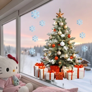 Detail of Christmas tree and gift box window decals with blue snowflakes for party decor