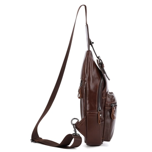 Side view of men's leather chest bag showing layered structure and metal zippers