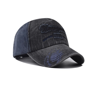 Close-up of vintage washed cotton baseball cap with New York embroidery and shark print