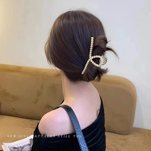 Elegant Korean style large pearl hair claw clip with golden alloy frame for women