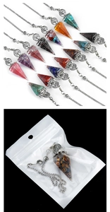 Detailed macro view of hex cone crystal resin pendants with tree of life metal decor