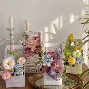Exquisite floral gift boxes with roses and lilies featuring MADE FOR LOVE printed text