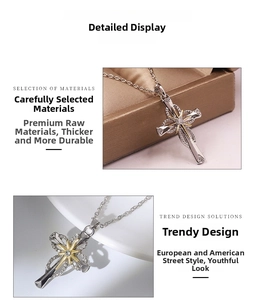 Close-up of silver cross necklace featuring a gold starburst and inlaid small diamonds