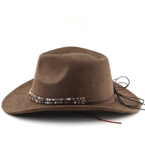 Detail of brown felt cowboy hat featuring woven band with studs and leather cord accent