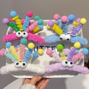 Cute plush shark hair clips with spring eyes and colorful pom-poms for women