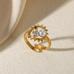 Adjustable gold stainless steel ring set with white pearl, clear and green gemstones