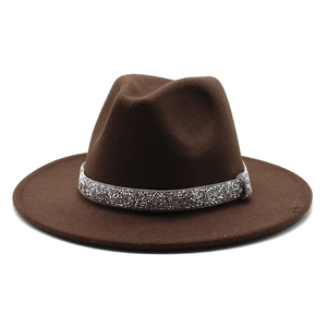 Close-up of dark brown wool fedora hat with a silver rhinestone-encrusted decorative band