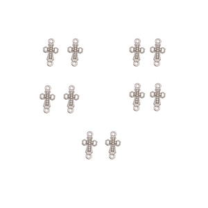 Macro view of ten silver cross charms with beaded edges for DIY jewelry making