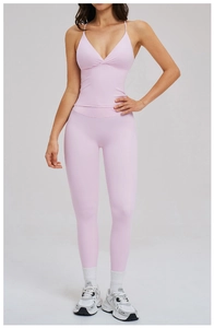 Detail of light purple yoga set featuring thin strap V-neck top and high waist leggings