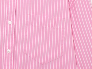 Close-up of pink striped long sleeve shirt showing button detail and front chest pocket