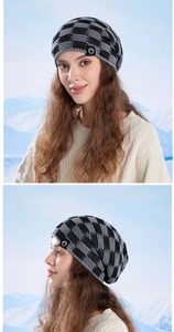 Detail of checkered knit beanie with warm fleece lining and round logo patch