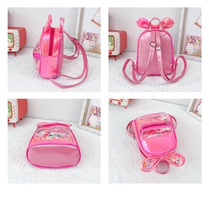 Detailed view of pink shiny mini backpack with cute rabbit ears and sequin heart pocket