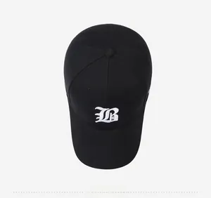 Top view of black cotton baseball cap showing detailed 3D white gothic B embroidery