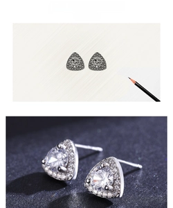 Macro view of S925 silver triangle stud earrings with sparkling cubic zirconia inlay