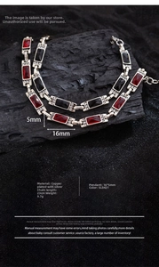 Detailed close-up of vintage silver bracelet with red and black crystal zircons