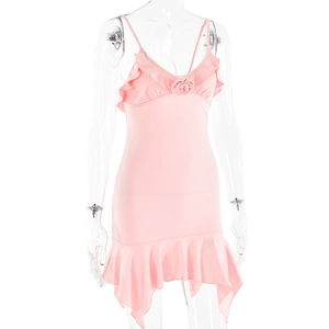 Detail of pink V-neck strap dress featuring ruffle neckline and rose flower decoration