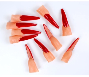 Detailed view of red pointed witch fingernails for Halloween cosplay and dress up