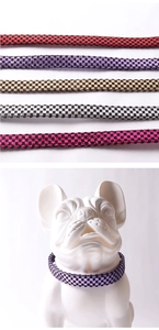 Detailed view of colorful laser checkerboard dog collars on a white bulldog model