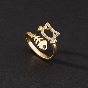 Adjustable gold ring featuring cubic zirconia Hello Kitty and pink gemstone fishbone