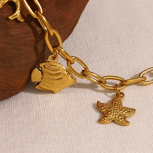 18K gold plated starfish and tropical fish charm necklace with nautical ocean theme