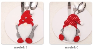Detail of Christmas gnome cutlery holders in red polka dot and corduroy fabric designs