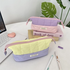 Quilted color-block large capacity pencil case with wave pattern and zipper closure