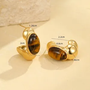 Detailed view of chunky gold hoop earrings with tiger's eye inlay and precise measurements