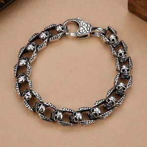 Detailed close-up of retro stainless steel skull links and sturdy lobster clasp on bracelet