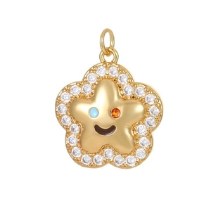 Gold star pendant with colorful gem smile and clear zircon inlay on white background