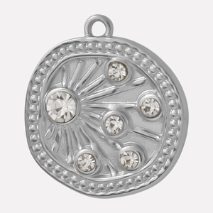 Detailed view of silver 304 stainless steel round pendant with sparkling crystals