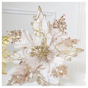 Close-up of champagne gold SwanLace Christmas flower with shimmering glitter and sequins
