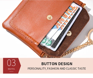 Close-up of brown leather card wallet featuring golden snap button and chain attachment