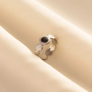 French vintage 304 stainless steel open ring with black enamel circle on beige fabric