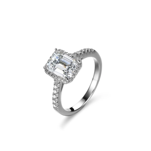 Emerald cut moissanite ring in sterling silver with halo setting and pavé diamond band