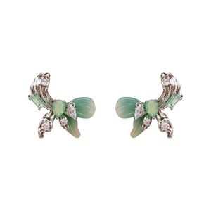 Elegant silver bow stud earrings featuring green zircon tassels in a minimalist design